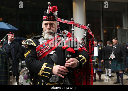 April 9, 2016 - New York City, NY, U.S - A bagpiper warms up before New York Tartan Day Parade, the annual celebration of Scottish heritage and pride in the United States. Thousands of Scots and people of Scottish heritage from across the world descended on the Big Apple for the celebrations, which marked the end of the city's Tartan Week.  The rain didn't stop kilt-wearing bagpipers, drummers, shinty players, Vikings or Scottish Clans from having a great time. (Credit Image: © Krista Kennell via ZUMA Wire) Stock Photo