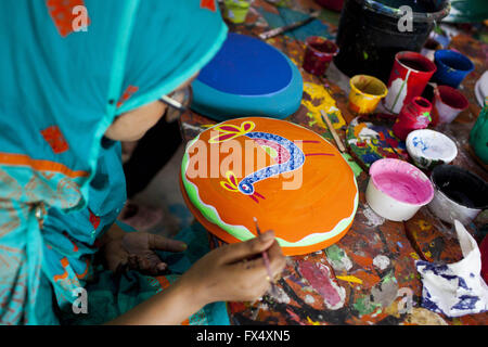 Dhaka, Dhaka, Bangladesh. 11th Apr, 2016. April 11, 2016 Dhaka, Bangladesh ''“ Dhaka University Art Institute student take colorful preparation to celebrate upcoming Bengali New Year 1423 in Dhaka. Pahela Baishakh (the first day of the Bangla month) can be followed back to its origins during the Mughal period when Emperor Akbar introduced the Bangla calendar to streamline tax collection while in the course of time it became part of Bengali culture and tradition. © K M Asad/ZUMA Wire/Alamy Live News Stock Photo