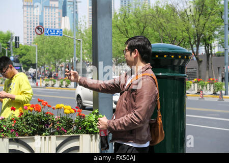 Shanghai, Shanghai, CHN. 11th Apr, 2016. Shanghai, CHINA - April 10 2016: (EDITORIAL USE ONLY. CHINA OUT) Last friday famous singer Luhan of EXO posted a picture on Weibo showing himself with a mailbox at Hankou Road in the Bund. This mailbox soon became a new tourist attraction and many fans come to queue to take a picture with it. © SIPA Asia/ZUMA Wire/Alamy Live News Stock Photo
