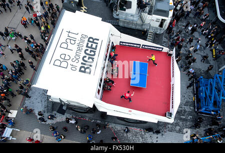 Table Tennis players Timo Boll (l) from Germany and Werner Schlager from Austria playing in the dump truck T264 of manufacturer Liebherr at the construction fair Bauma in Munich, Germany, 12 April 2016. More than 3,400 exhibitors from roughly 60 countries present their innovations from 11 April until 17 April 2016. PHOTO: SVEN HOPPE/dpa Stock Photo