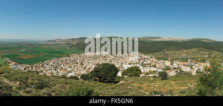 Arab village panorama with Mount Tabor in Israel Stock Photo