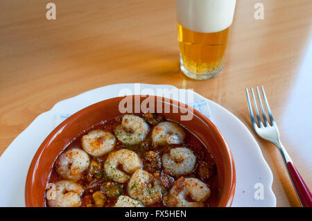 Gambas al ajillo, typical food made of shrimps, fried garlic and olive oil. Spain. Stock Photo