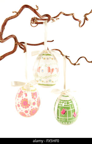 Colourful easter eggs hanging on a branch Stock Photo
