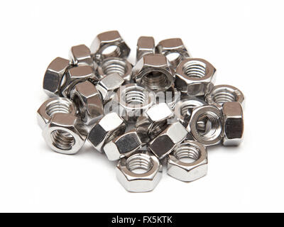 Closeup of galvanised hexagon nuts on a white background Stock Photo