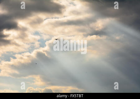 Shafts of sunlight coming through clouds Stock Photo