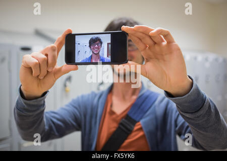 Student taking his selfie on smartphone Stock Photo