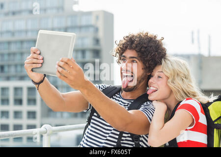 Young couple taking a selfie with digital tablet Stock Photo