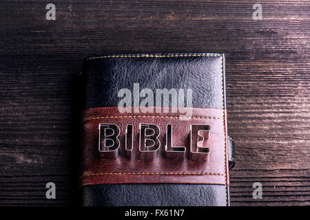 Bible on wooden table, sign made of cookie cutters Stock Photo