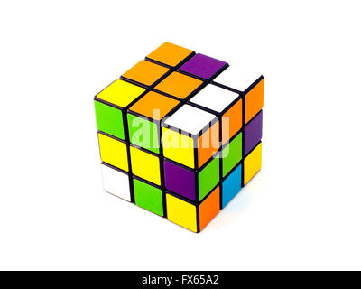 Rubik's cube with unusual colors on white background. It was invented by Hungarian architect Erno Rubik. Stock Photo