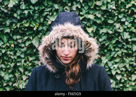 Caucasian woman wearing fur hood Stock Photo