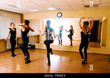 Caucasian dancers practicing in studio Stock Photo