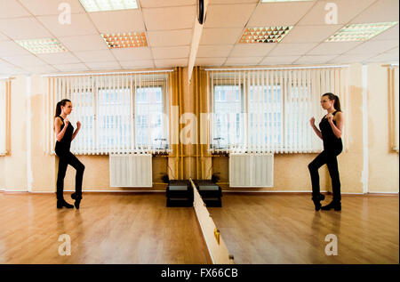 Caucasian dancer practicing in studio Stock Photo