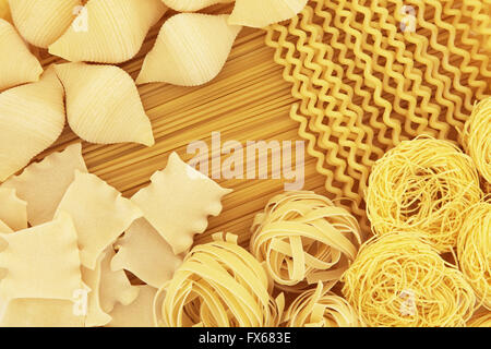 Italian spaghetti pasta dried food selection forming an abstract background. Stock Photo