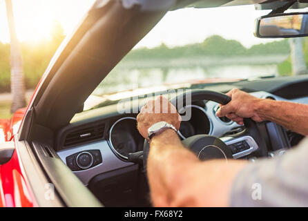 Caucasian man driving convertible Stock Photo