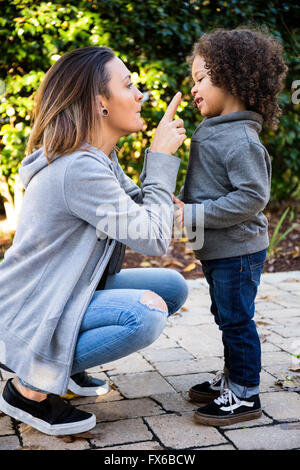 Mother and son playing outdoors Stock Photo