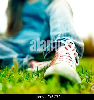 Close up of Caucasian woman wearing sneakers Stock Photo