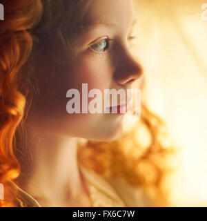 Profile of Caucasian teenage girl with curly hair Stock Photo