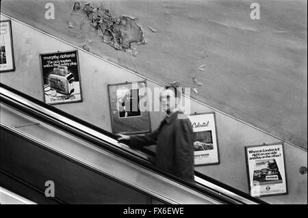 Archive image of a single male commuter on a Northern Line escalator, London Underground, London, England, 1979, showing contemporary advert for a Morphy Richards toaster  London 1970s Stock Photo