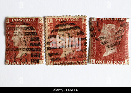 3 Victorian penny red postage stamps Stock Photo