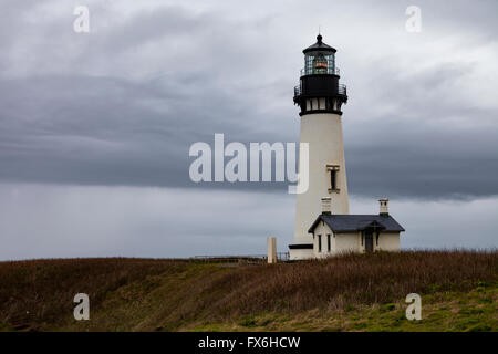 Yaquina Head Lighthouse stands near the town of Newport along Oregon's coastline. Stock Photo