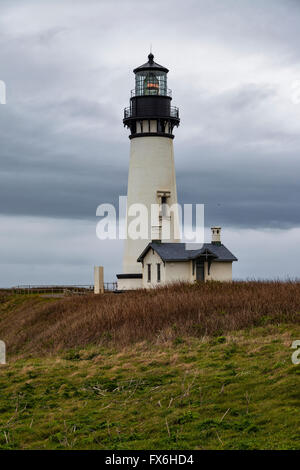 Yaquina Head Lighthouse stands near the town of Newport along Oregon's coastline. Stock Photo