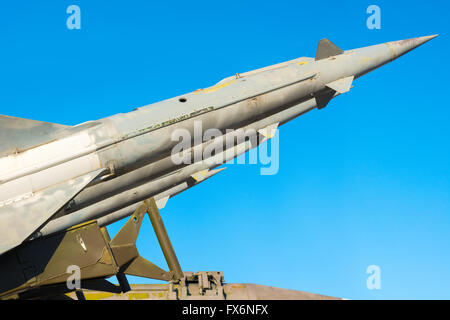 anti aircraft rockets of a surface-to-air missile system are aimed at the blue sky, close up Stock Photo