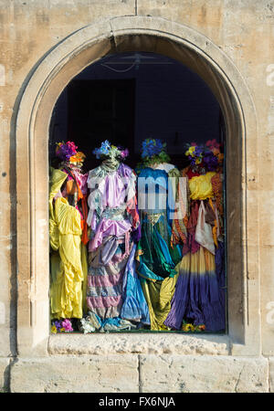 Colourful womens clothes in a shop window. Glastonbury, Somerset, England Stock Photo