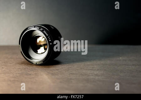 Very popular Canon EF 50mm f/1.8 II lens on black background Stock Photo