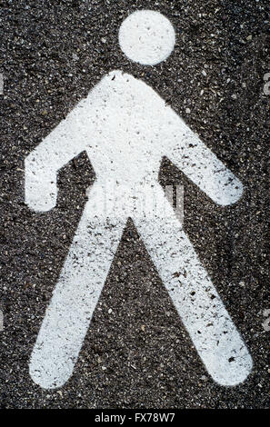 White pedestrian lane sign on asphalt. Road sign Stock Photo