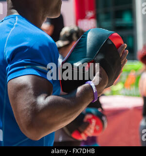Fitness and Boxing Workout with Red Punch Mitts at Gym Stock Photo