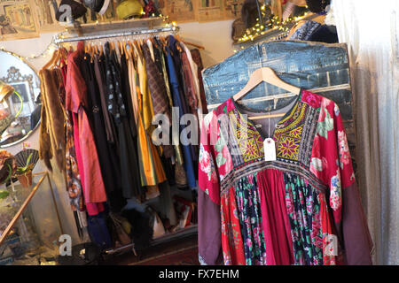 Ludlow retro clothing and old fashions including an Afghan dress at 55 Mill Street an antique and retro shop Shropshire UK Stock Photo
