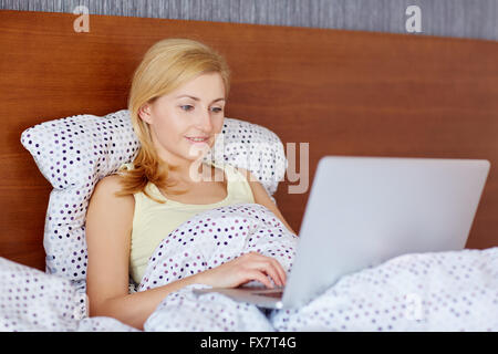 Starting her day with the latest news Stock Photo