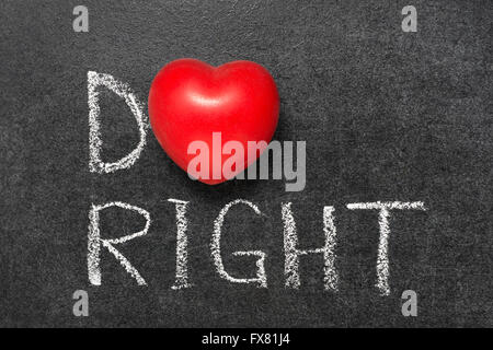 do right phrase handwritten on blackboard with heart symbol instead O Stock Photo