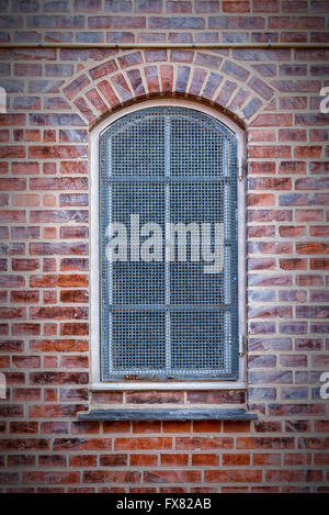 A grilled window in the Danish town of Helsingor. Stock Photo