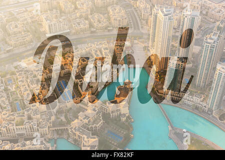 Name of city Dubai written on background of downtown morning scene. Top view from above Stock Photo