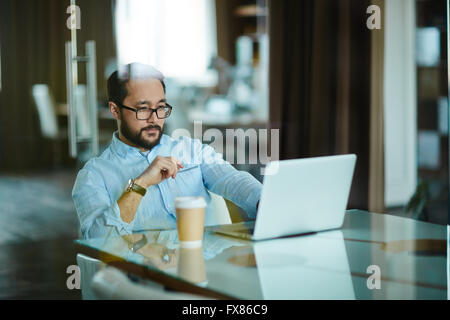 Serious businessman at work Stock Photo