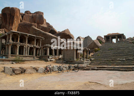 Eastern end of the Hampi Bazaar, Hampi, Karnataka, India. Sacred Center. A large mandapa on the left has a monolithic Nandi bull Stock Photo