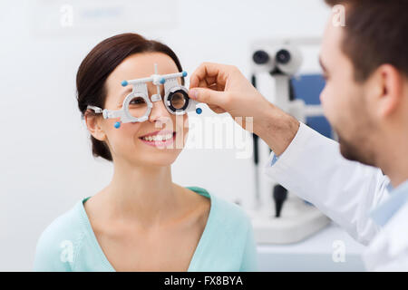 optician with trial frame and patient at clinic