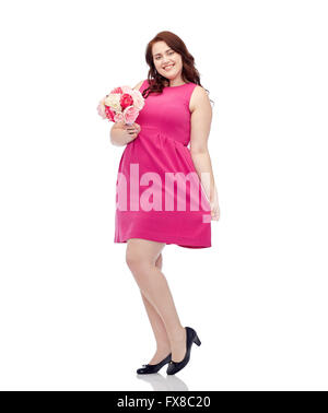 happy young plus size woman with flower bunch Stock Photo