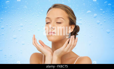 young woman face and hands Stock Photo