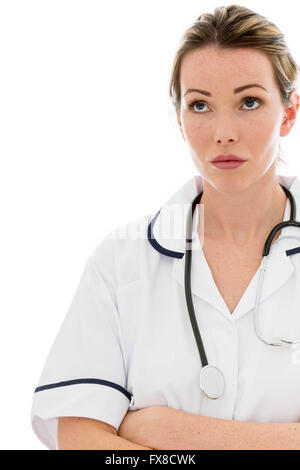 Thoughtful Female Doctor With A Stethoscope Isolated Against A White Background With Her Arms Folded Stock Photo