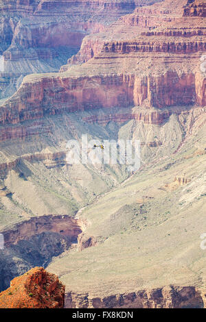 Helicopter carrying load over Grand Canyon, Arizona, USA. Stock Photo