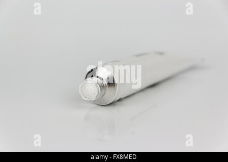 white paint tube macro on white background Stock Photo