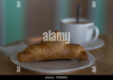 Traditional French Croissant served with coffeee at a small bakery in Cebu City,Philippines Stock Photo