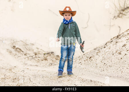 boy in a sheriff hat with a gun Stock Photo