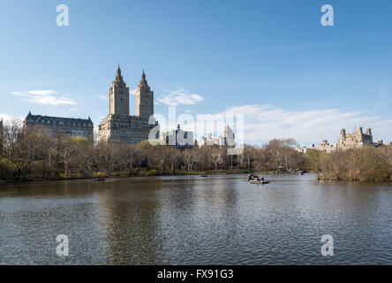 View across The Lake in Central Park, New York, towards the two towers of The San Remo and Central Park West Stock Photo