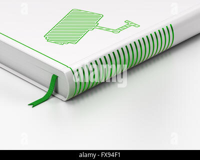 Protection concept: closed book, Cctv Camera on white background Stock Photo