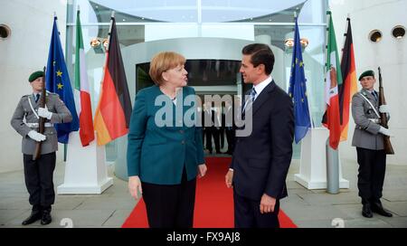 German Chancellor Angela Merkel speaks with Mexican President Enrique Pena Nieto following a joint press conference at the Chancellery April 12, 2016 in Berlin, Germany. Merkel offered support for training training Mexican soldiers in its fight against organized crime and the global war on drugs. Stock Photo