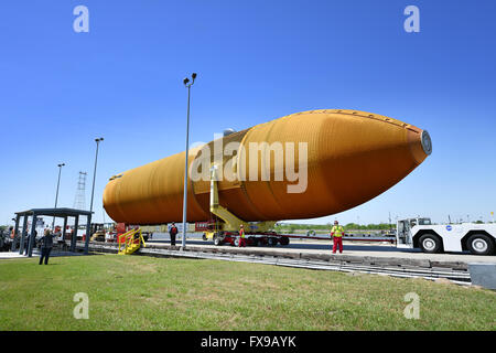 New Orleans, Louisiana, USA. 12th April, 2016. The last Space Shuttle external fuel tank begins a long journey to the California Science Center as it is moved to a barge at the Michoud Assembly Facility April 12, 2016 in New Orleans, Louisiana. The massive 154 feet long, 69,000 pound structure once fed liquid oxygen and liquid hydrogen to the space shuttle main engines and has been retired with the Shuttle program. Credit:  Planetpix/Alamy Live News Stock Photo