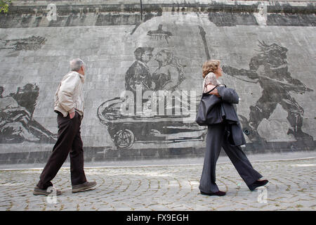 Marcello Mastroianni and Anita Ekberg in 'La dolce vita'. Rome 12th April 2016. The longest series of murals in Rome was just ended along the river Tiber by the South African artist William Kentridge, titled 'Triumphs and Laments'. The artist used a very simple, ecologic technique to realize the paintings: he 'cleaned' the layer of smog covering the walls along the river with vapor. The mural, 550mt long and made of 80 figures 10mt tall, tells the story, made of Triumphs and Laments, of Rome. Stock Photo